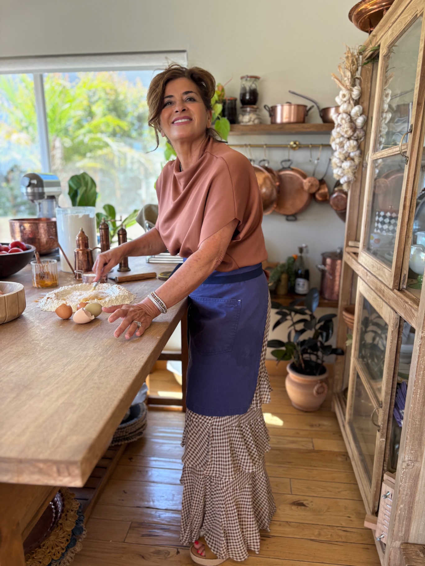 Fiona mixing fresh pasta dough at her kitchen table
