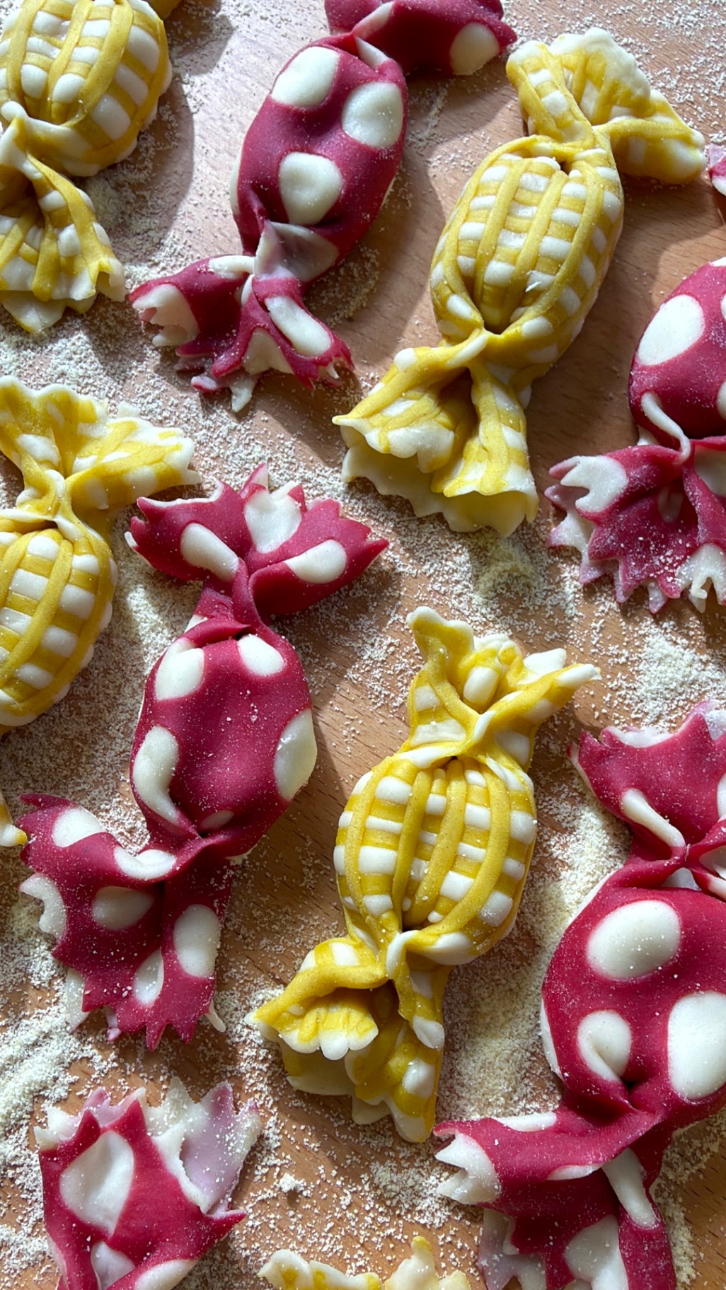 Candy-wrapper caramelle pasta in raspberry dots and golden gingham